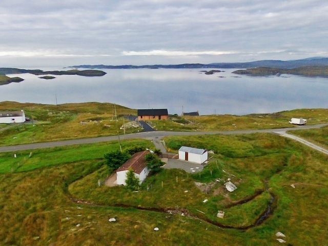 A view of houses near a body of water with small islands and roads at Braemore Chalet Tarbert Isle Of Harris