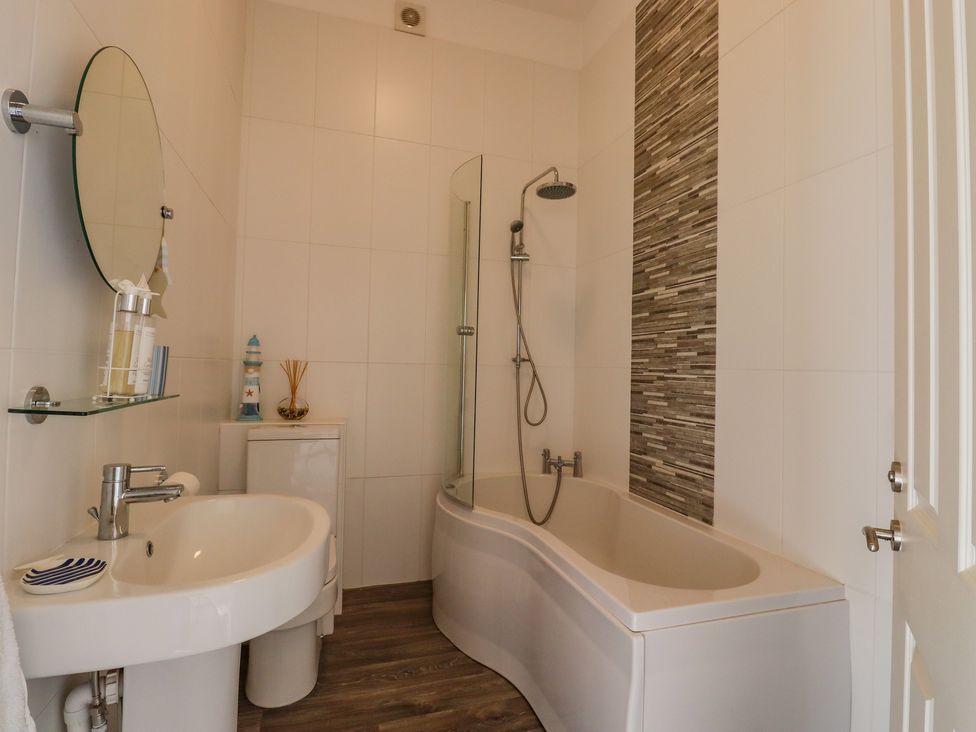 A bathroom with a sink toilet bathtub and shower at The Old Spy Headquarters in Folkestone